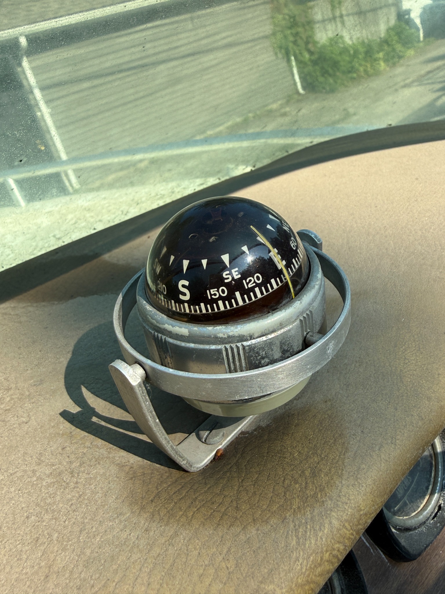 Original vintage compass aboard Decanter